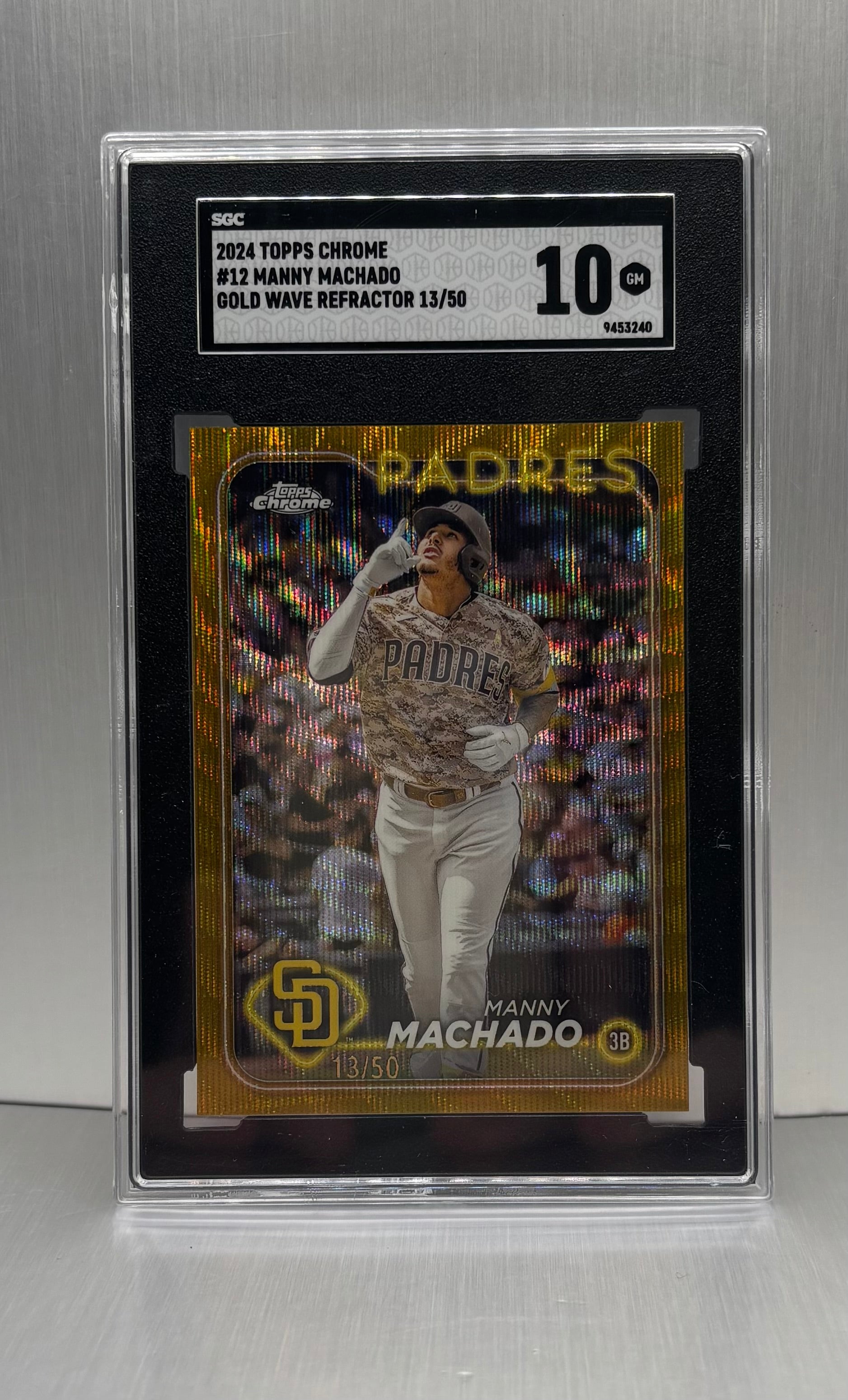 2024 Topps Chrome #12 Manny Machado Gold Wave Refractor /50